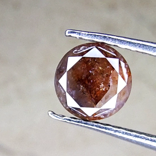 A Galaxy Within: 0.64 CTS Red Diamond with a Universe of Inclusions